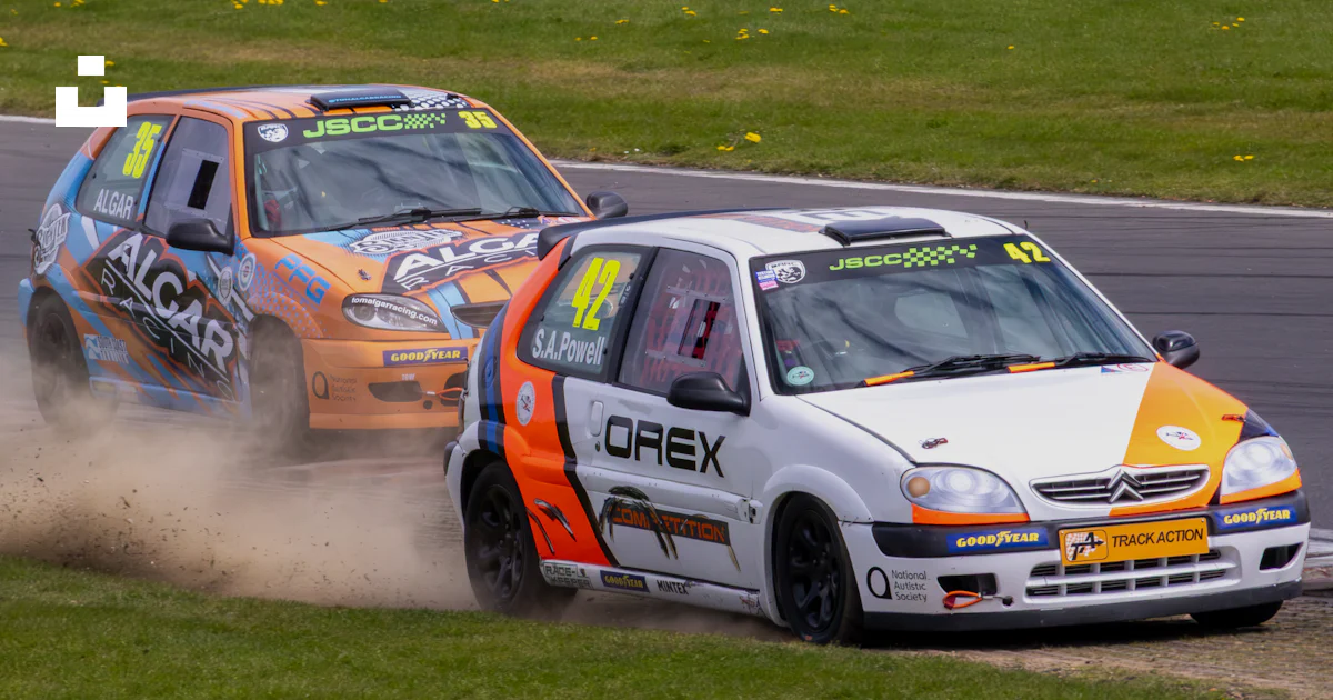 2 Cars Racing Real Life Two race cars competing on a track photo – Free Sport Image on Unsplash