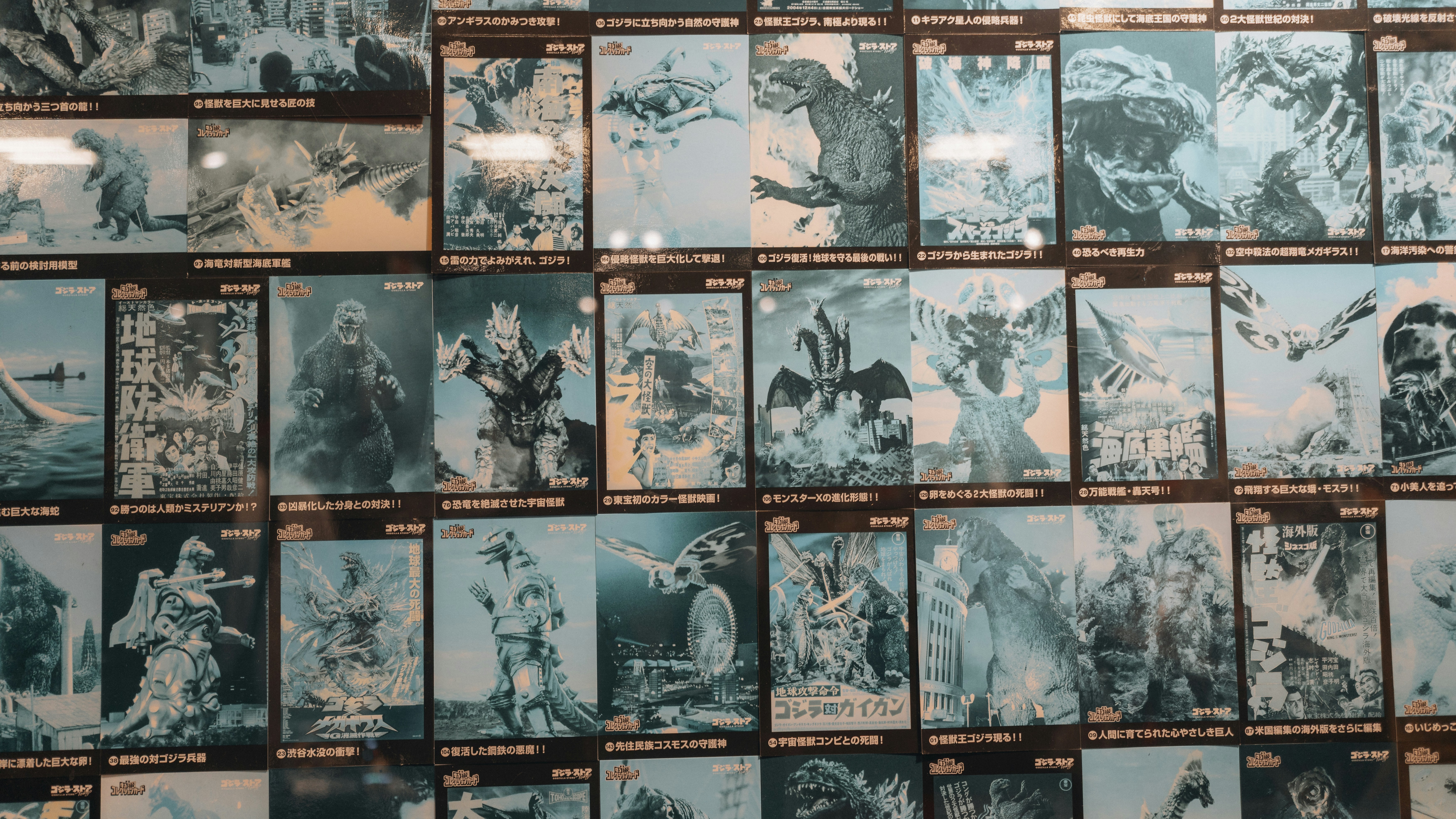 Wall of vintage monster movie posters displayed