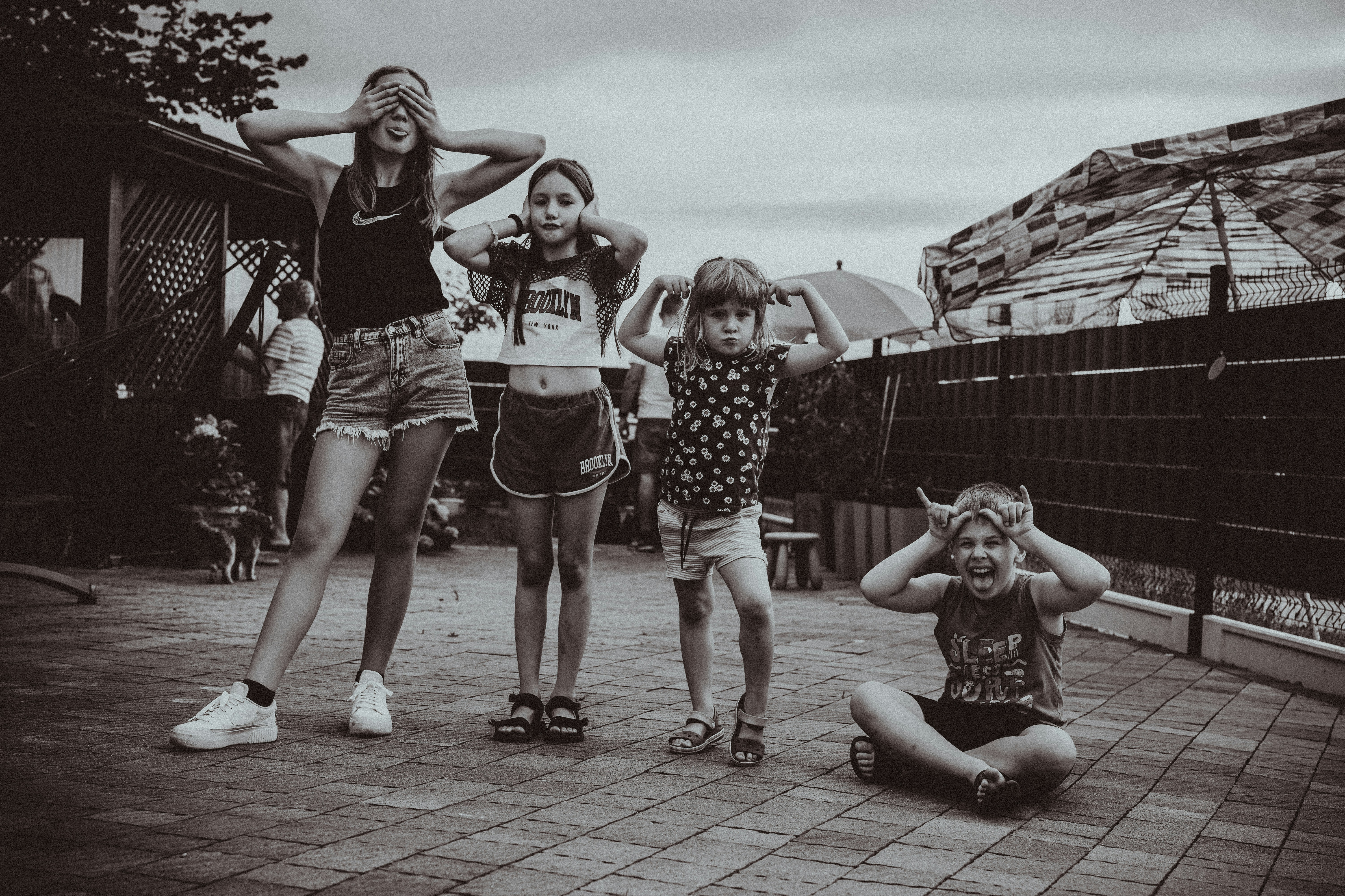 Four children making funny faces outdoors