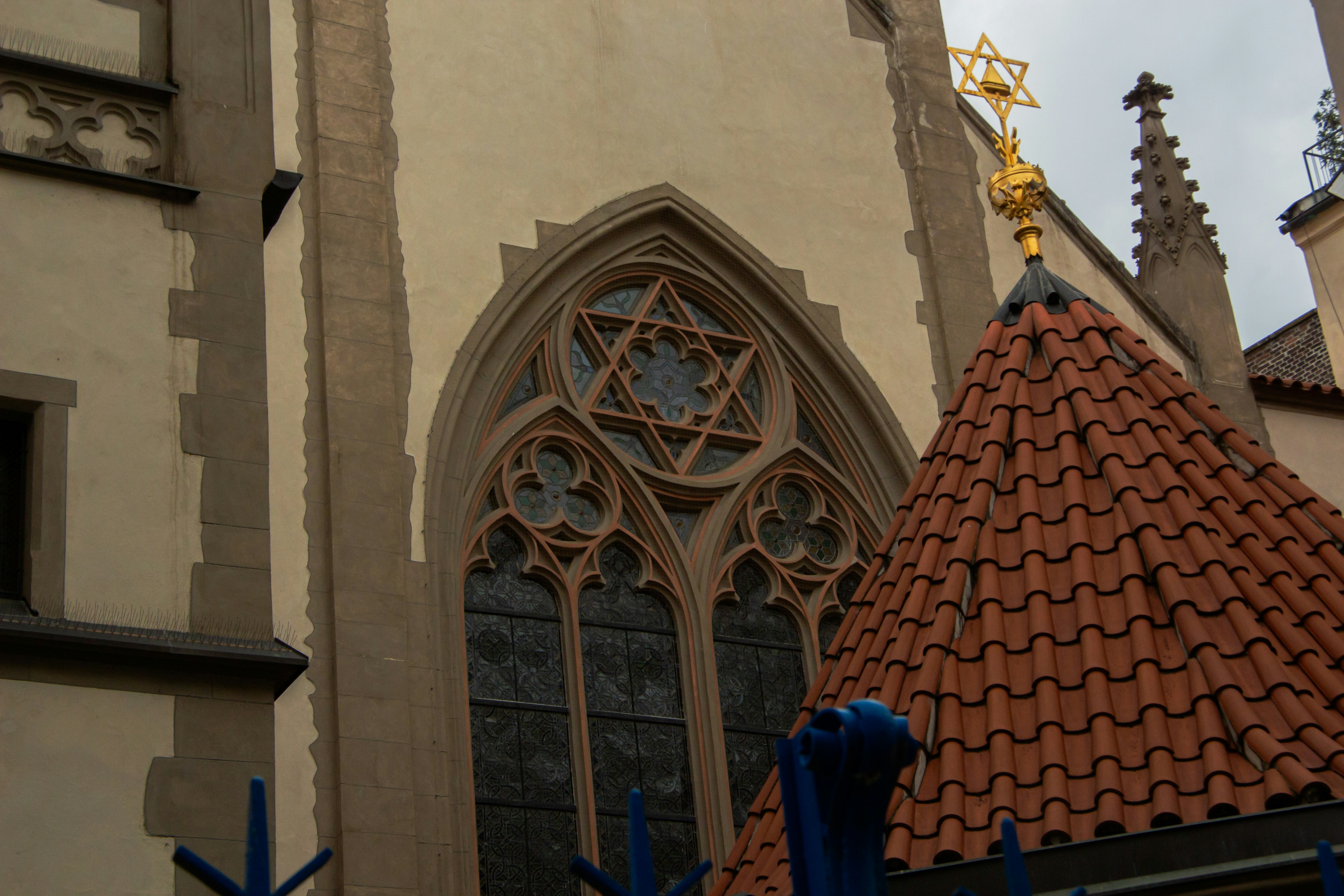 Star of david above ornate window on building