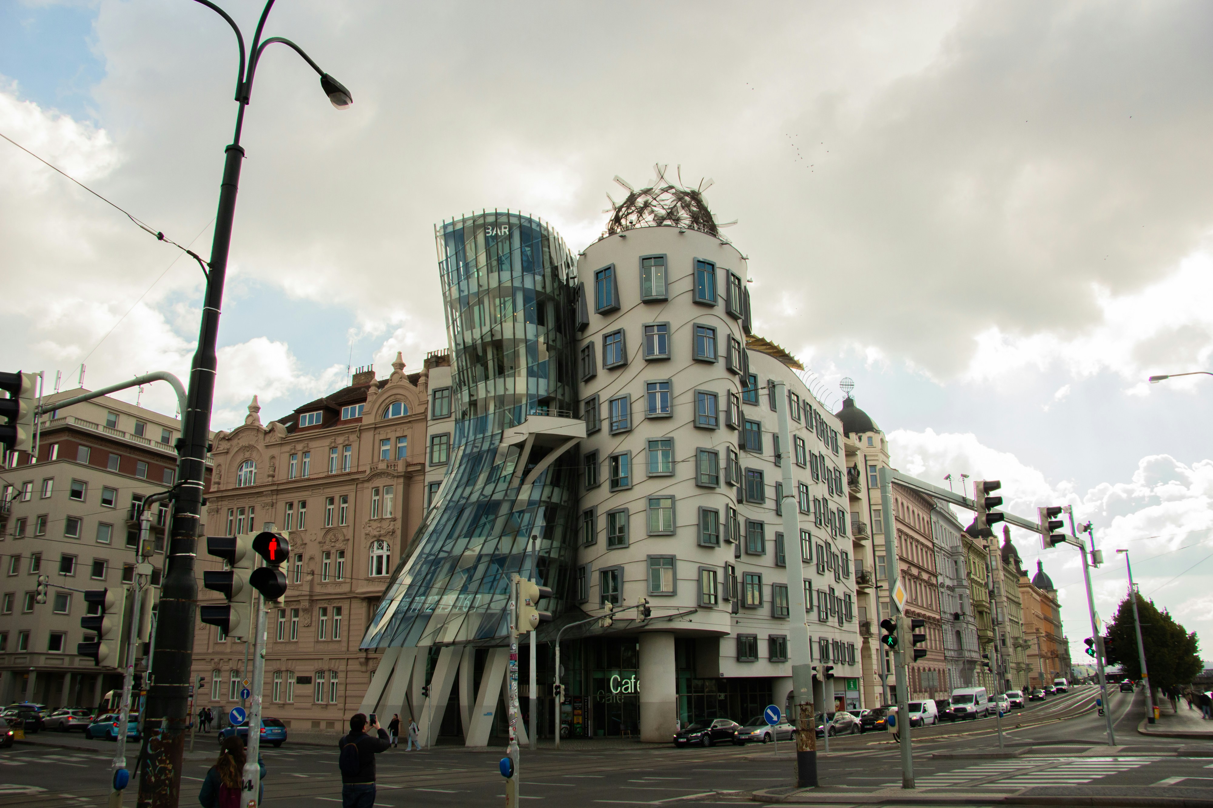 Modern deconstructivist building on a city street.