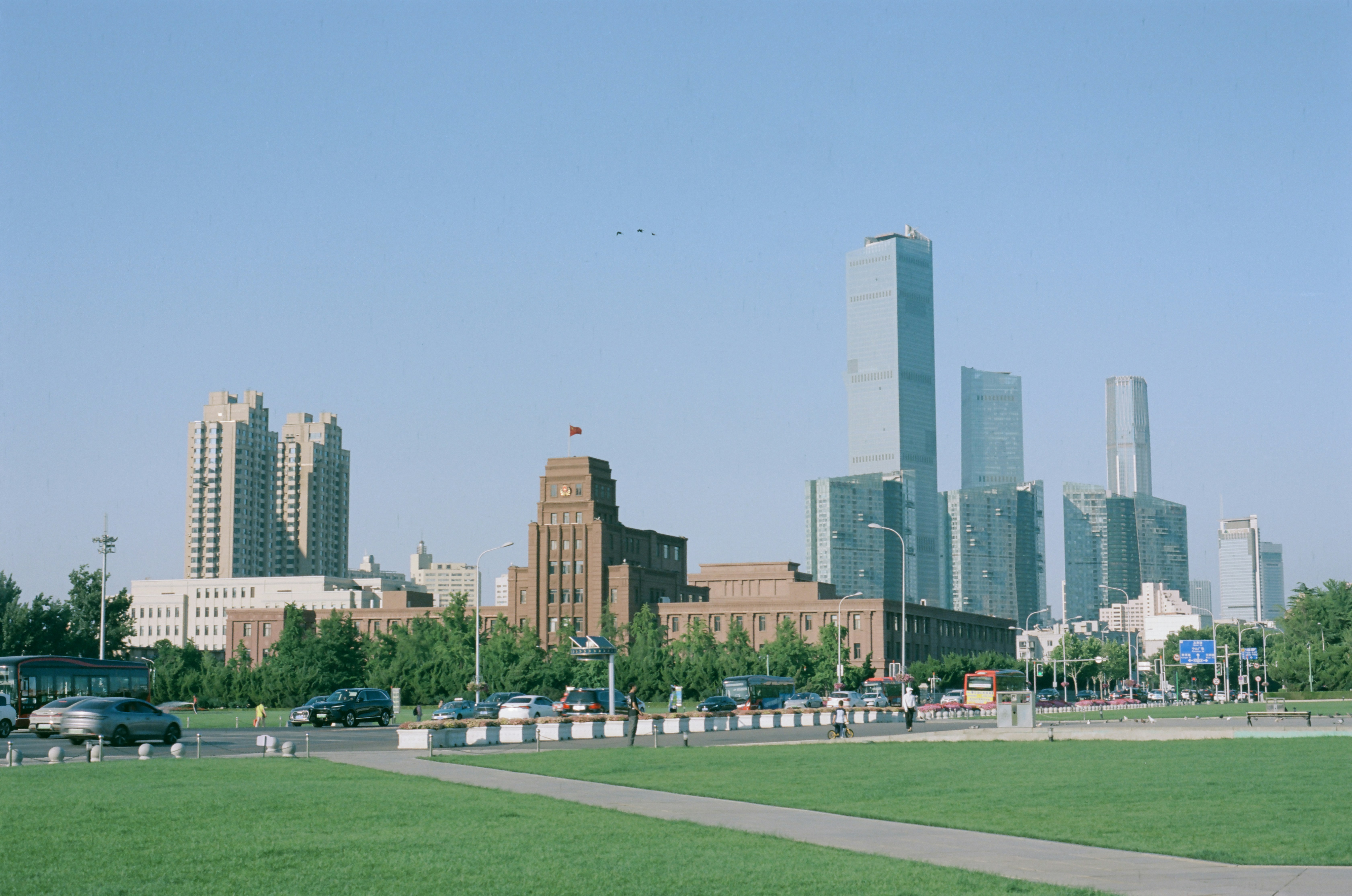 Modern skyscrapers and historic buildings in a city.