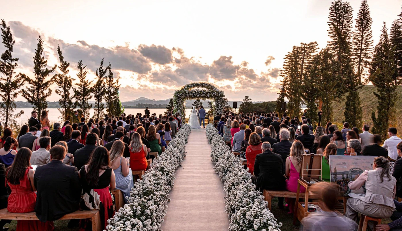 Outdoor wedding ceremony with guests seated by a lake showing the ceremony orientation and environment where sun angle determines whether the couple has flattering light or squints into the afternoon sun