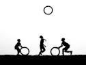 Children playing with hoops against a bright sky