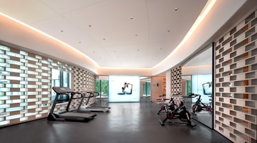 Modern gym with treadmills and exercise bikes