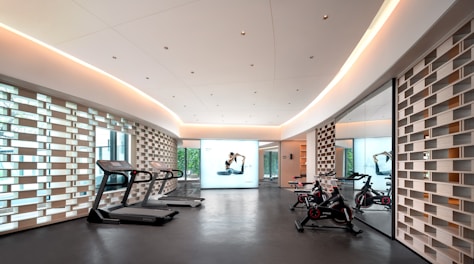 Modern gym with treadmills and exercise bikes