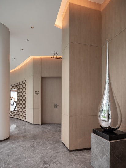 Modern interior with abstract sculpture and wood paneling