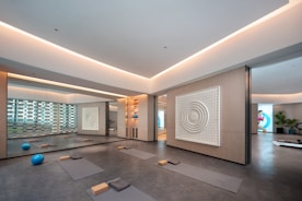 Modern yoga studio with mats and exercise balls.