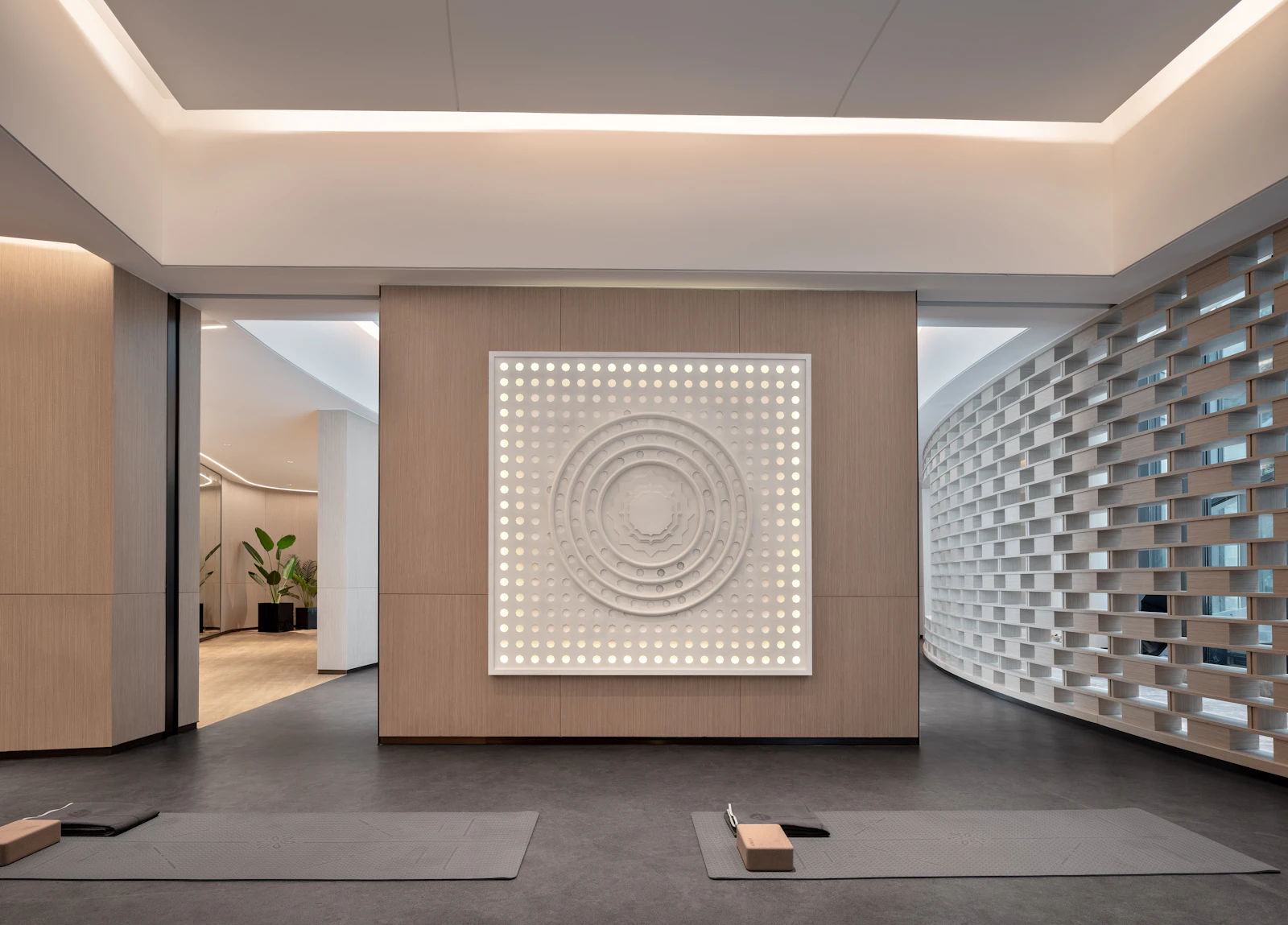 A minimalist yoga studio interior with soft daylight