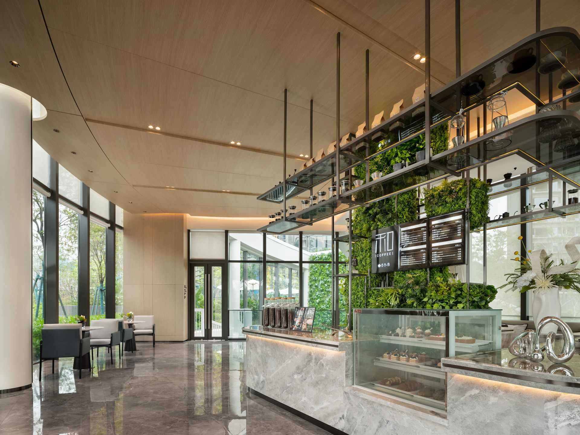 Modern cafe interior with plants and display counter