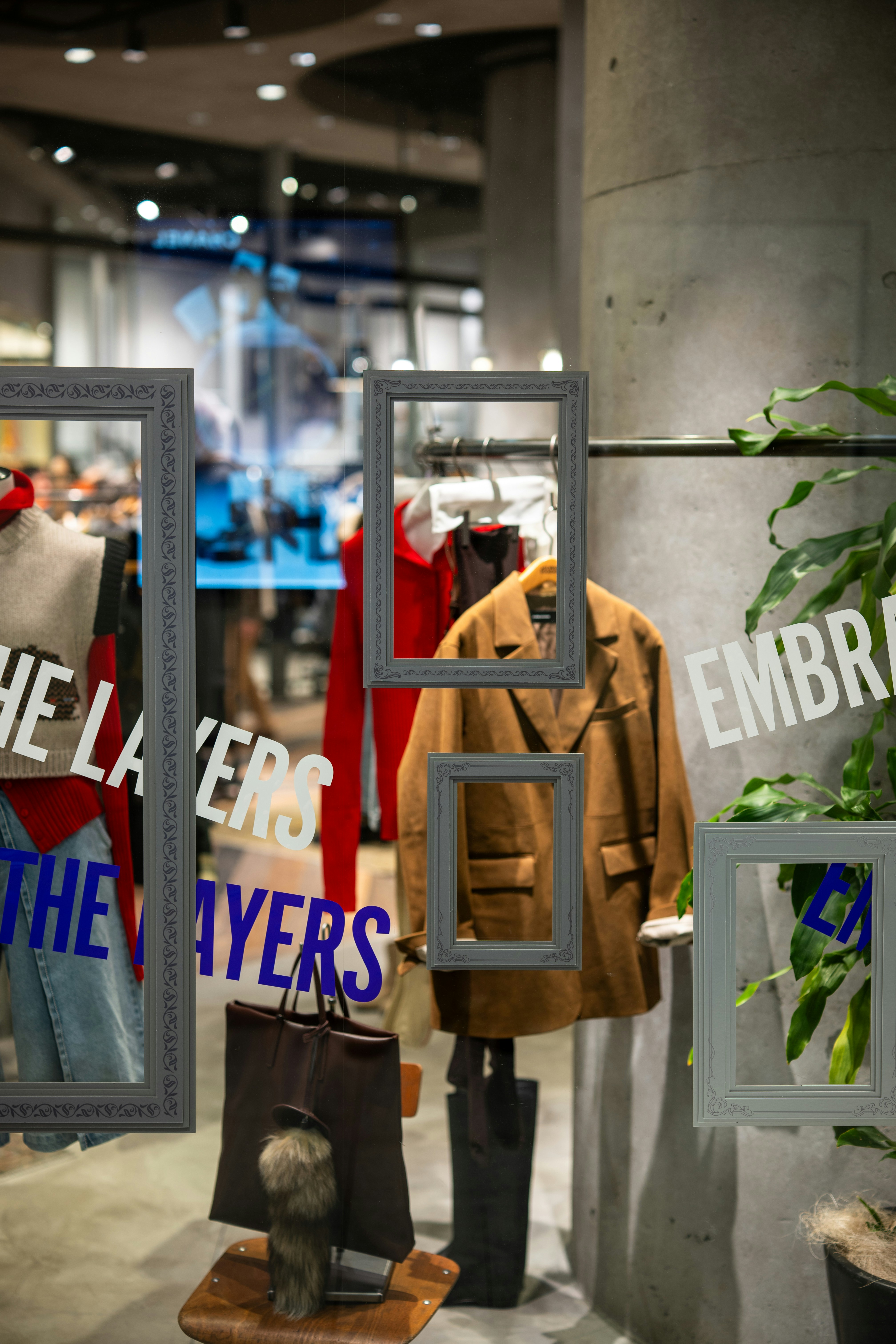Fashionable jacket displayed in a store window.