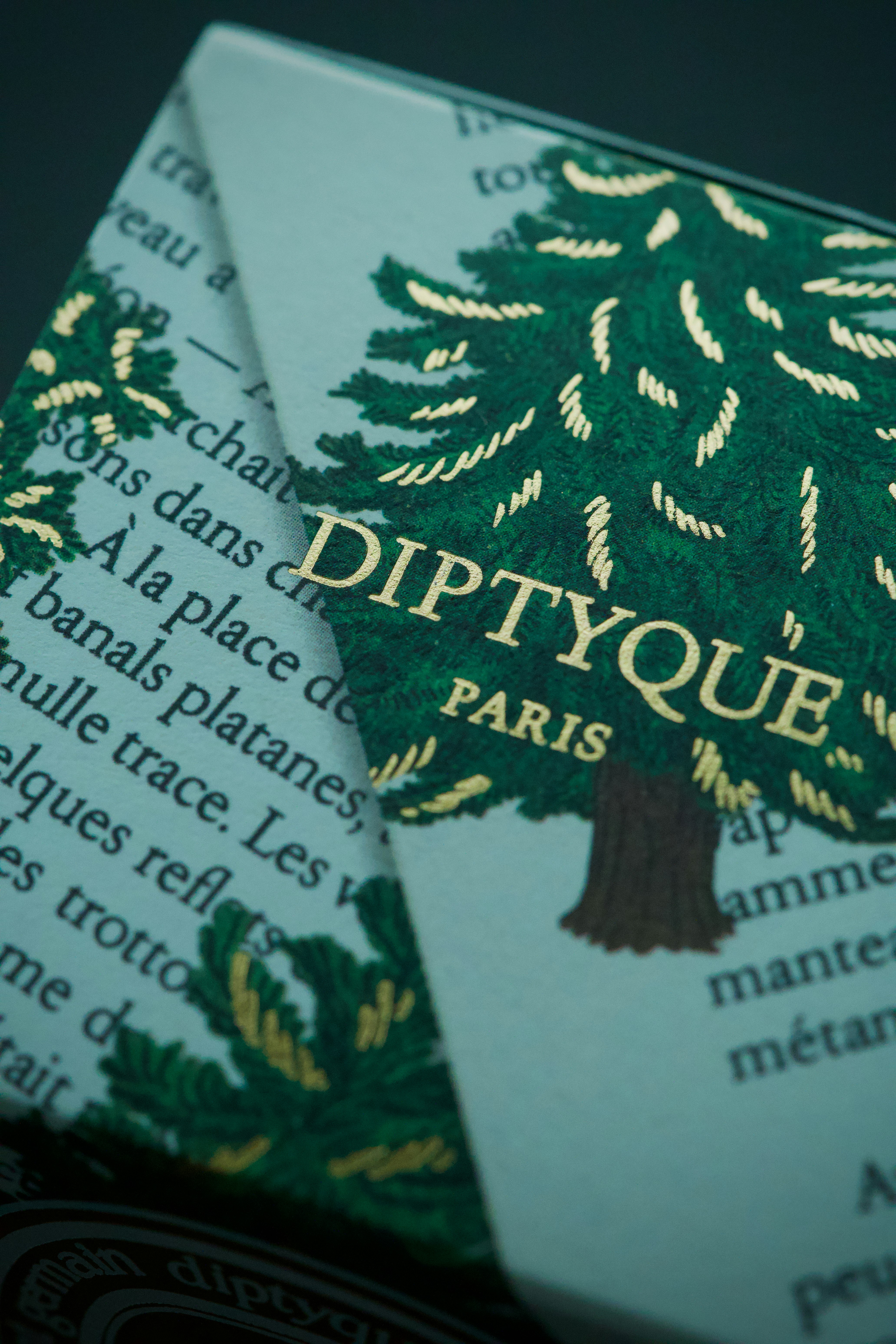 Diptyque paris packaging with a green pine tree design