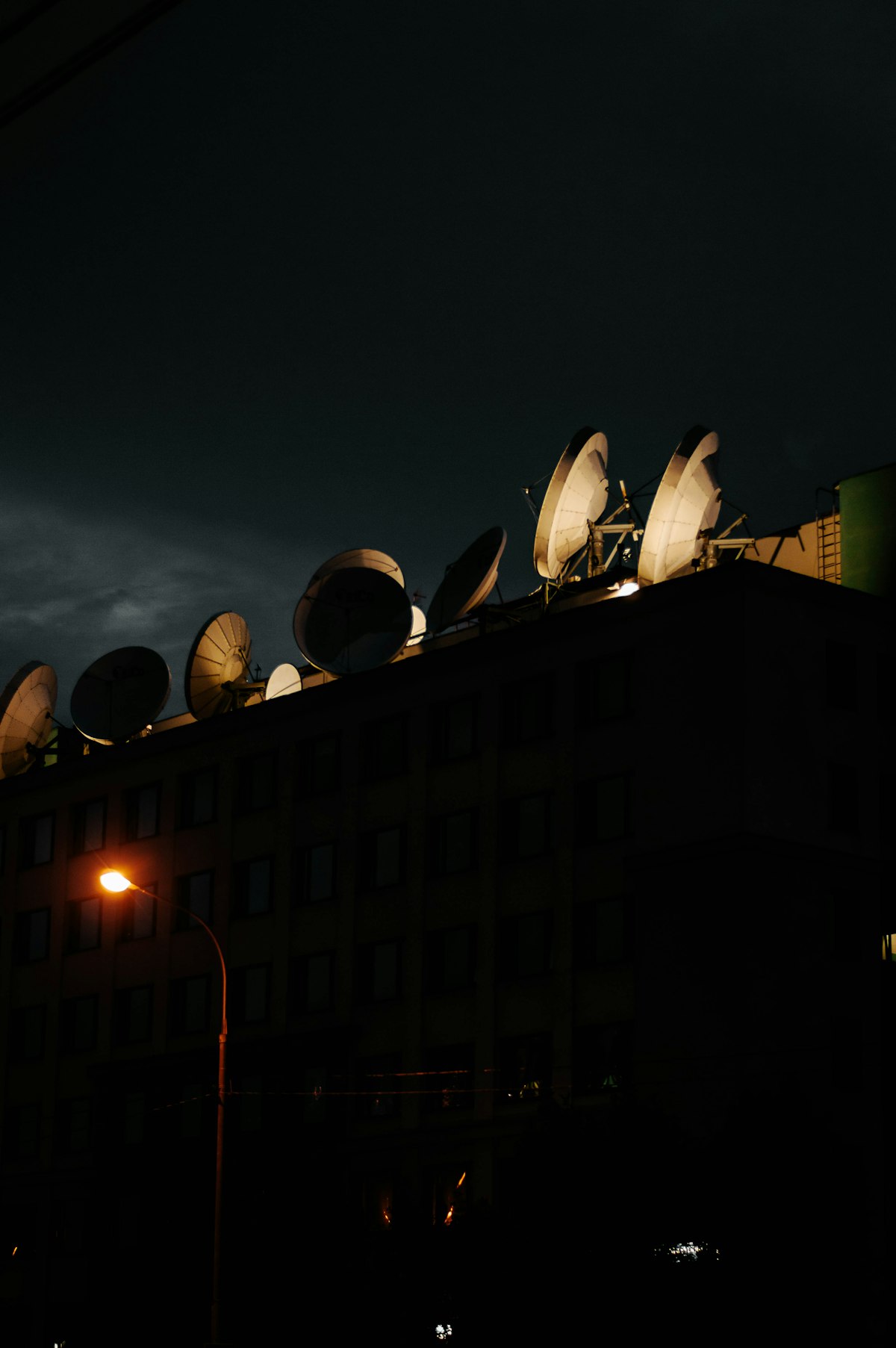 Satellite dishes on a rooftop representing broadcast television infrastructure