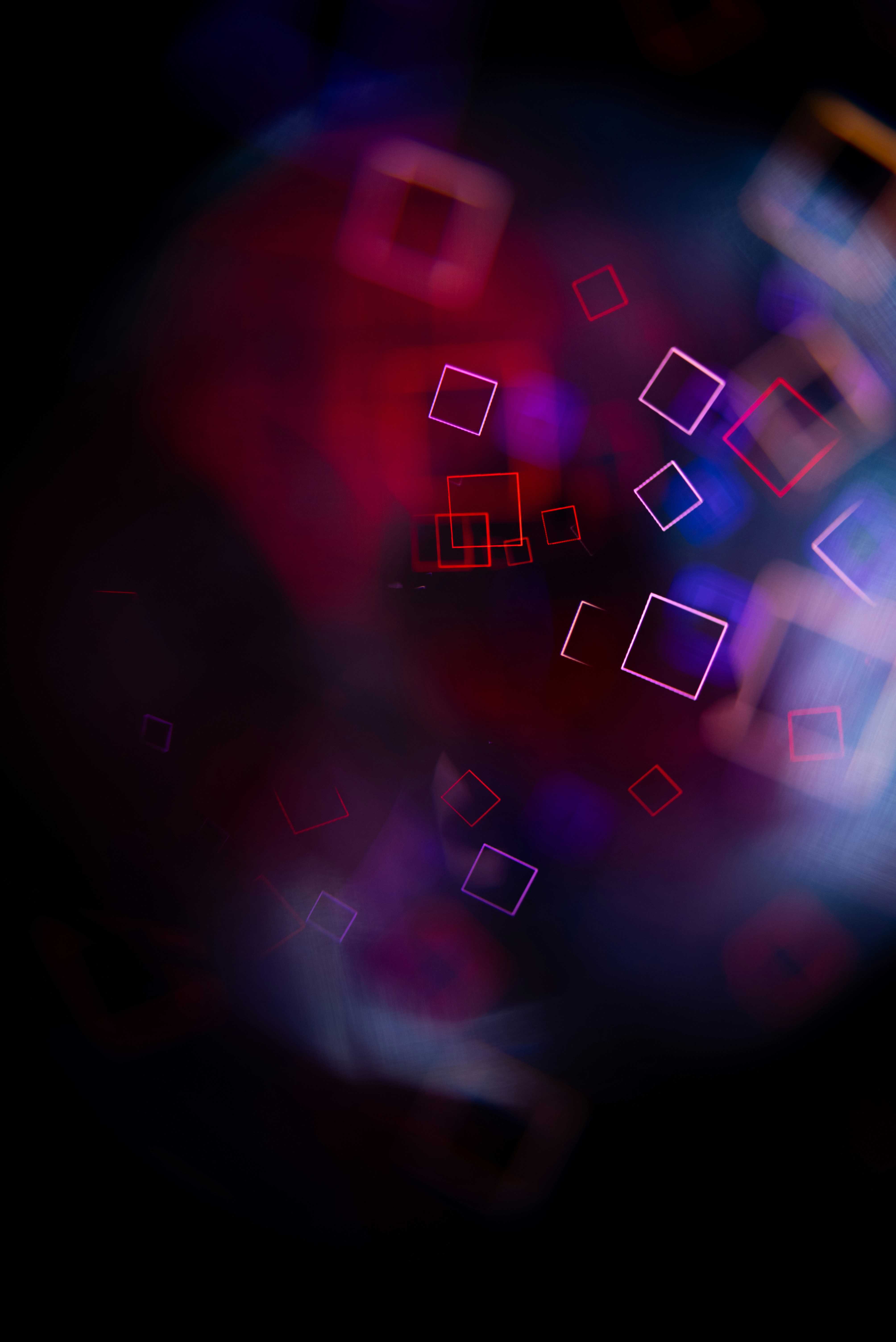 Abstract glowing squares with purple and red light.
