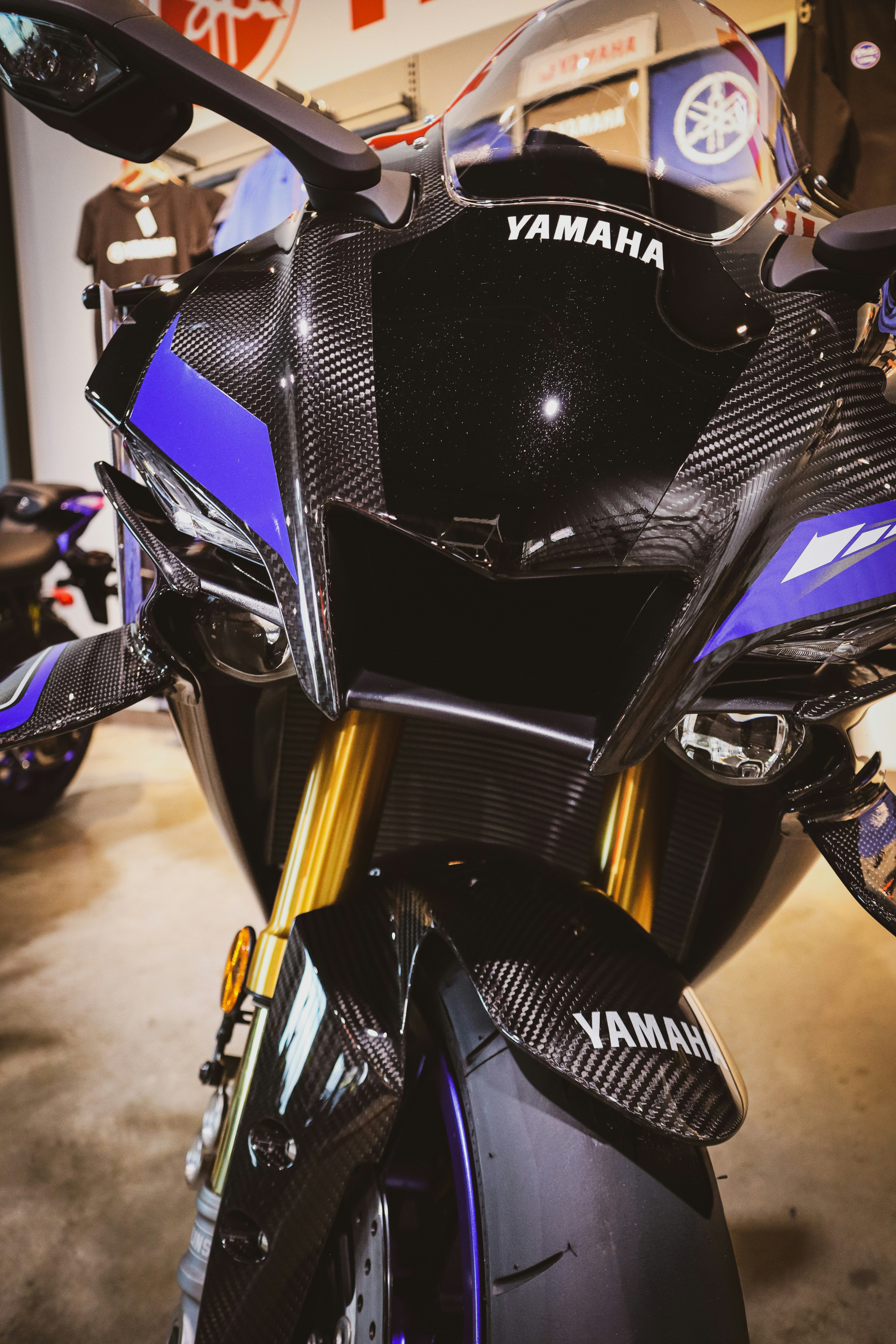 Close-up of a black and blue yamaha motorcycle