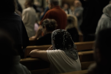 Woman wearing a headscarf in church