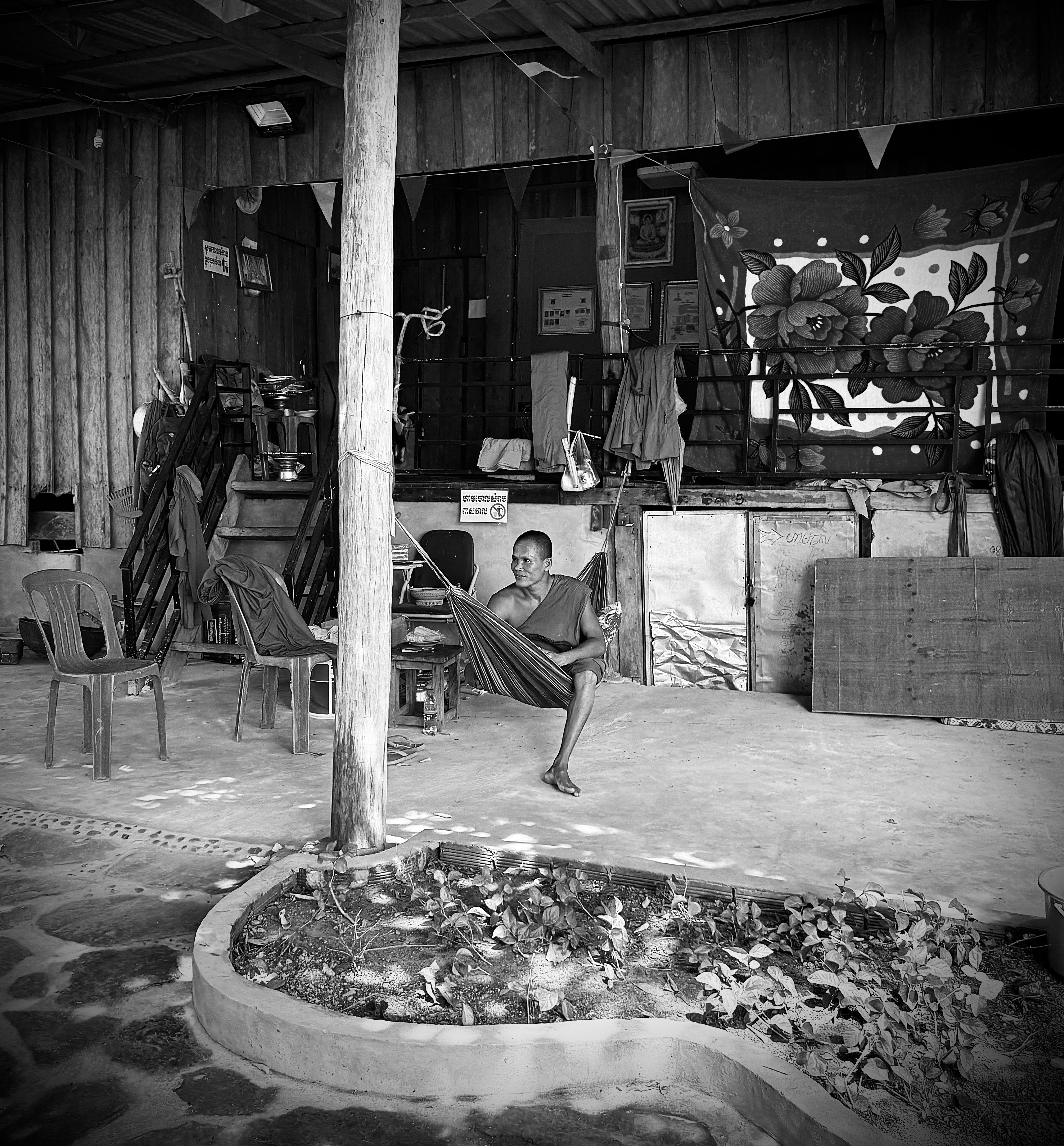 Man relaxing in a hammock in a rustic setting