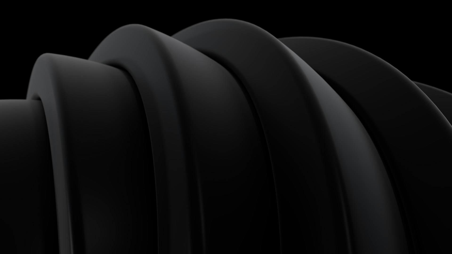 Abstract black ribbed texture against dark background