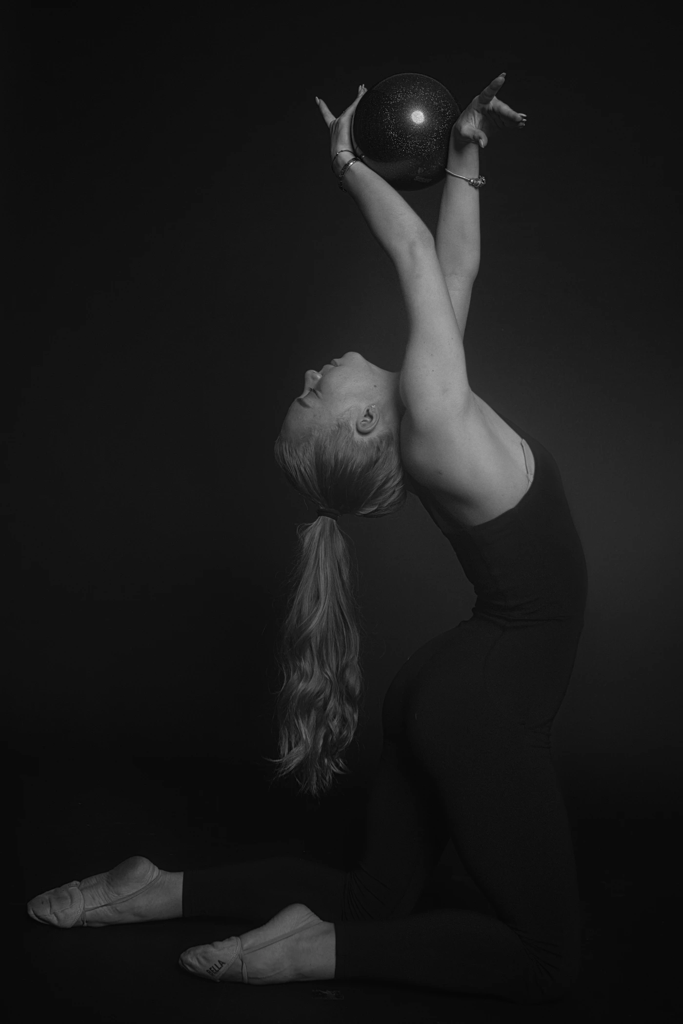 A rhythmic gymnast performing with a ball