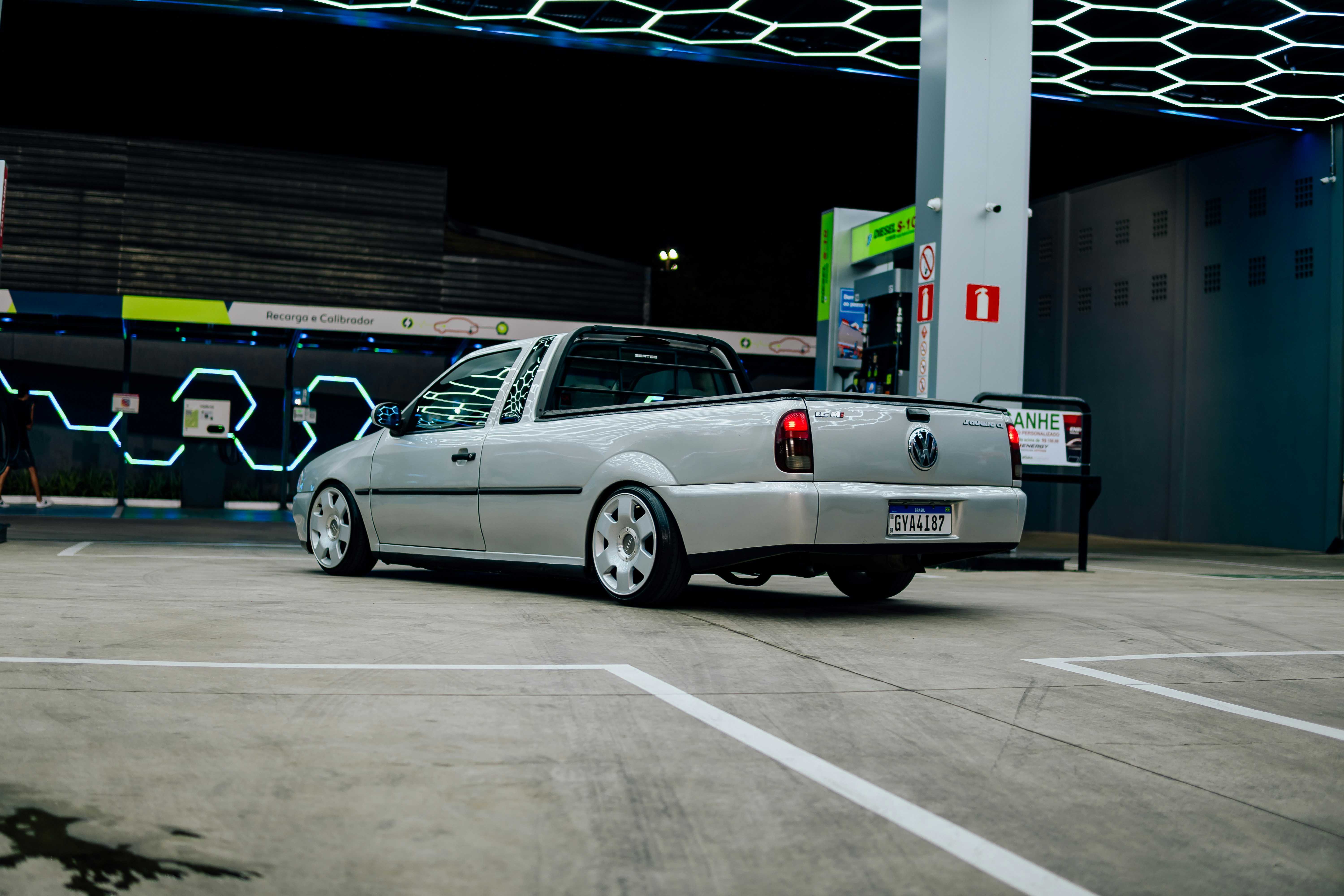 Silver pickup truck parked at a gas station