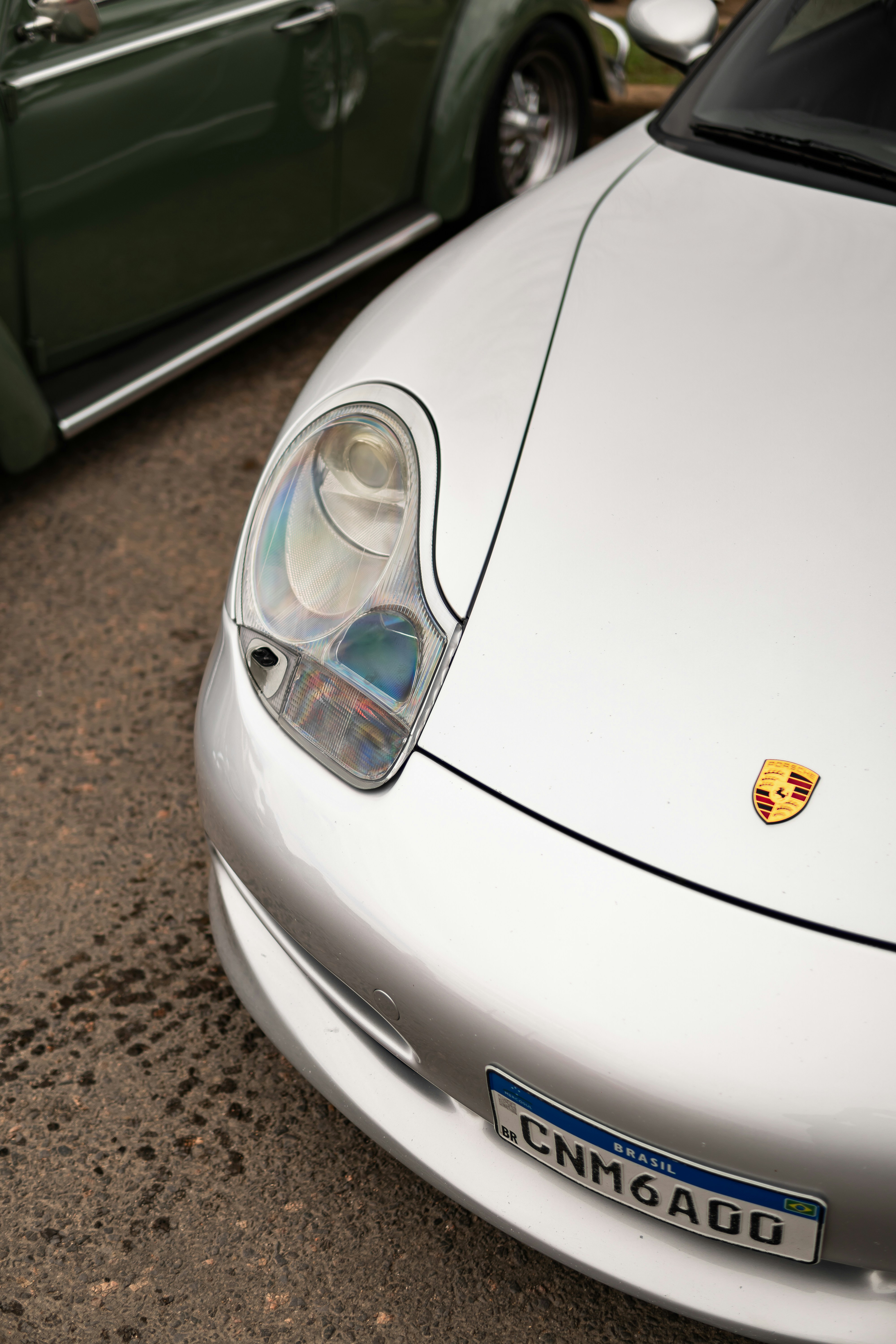 Silver porsche sports car with brazilian license plate