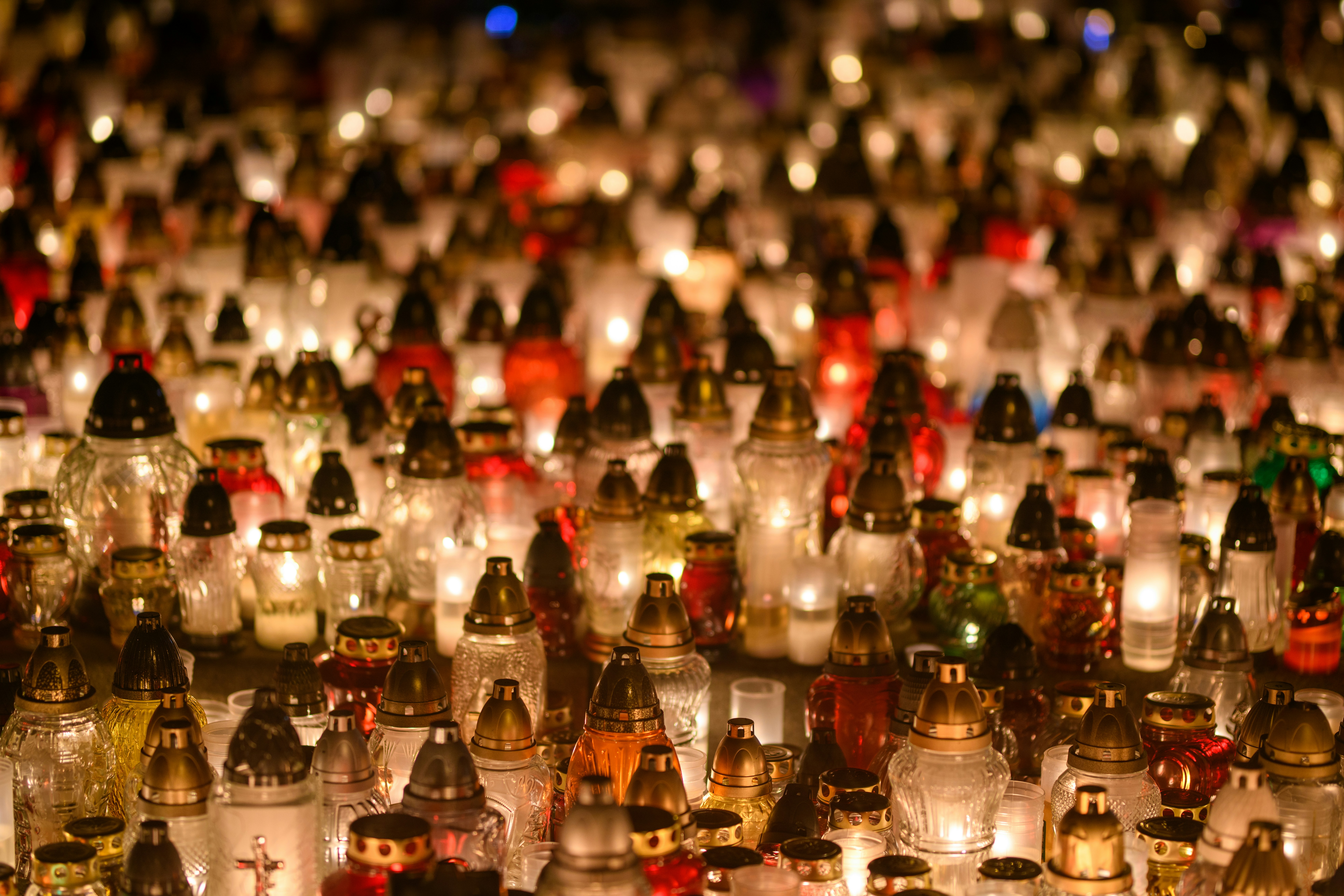 Thousands of lit candles glowing in the dark