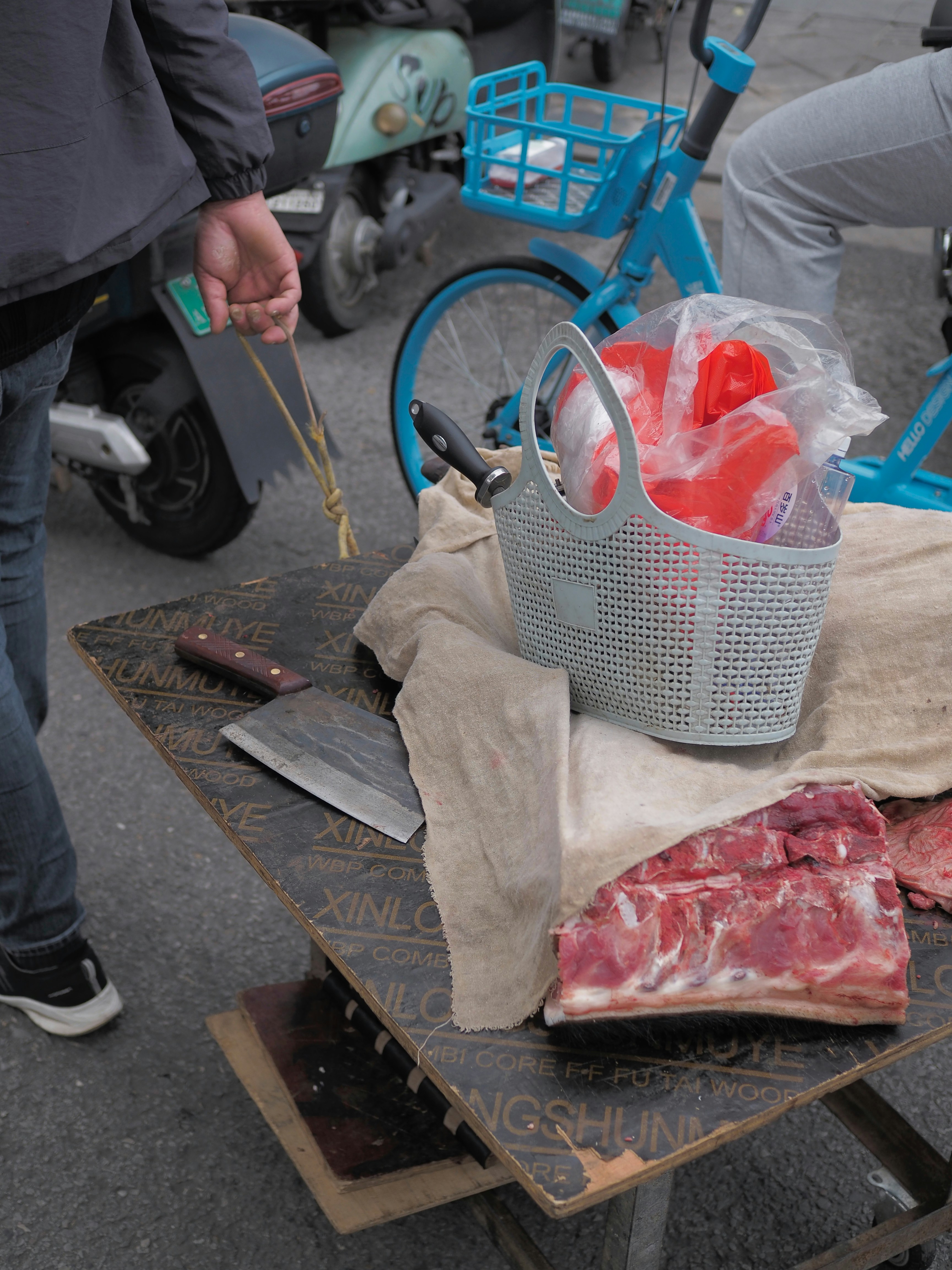 Raw meat and butcher knife on a table