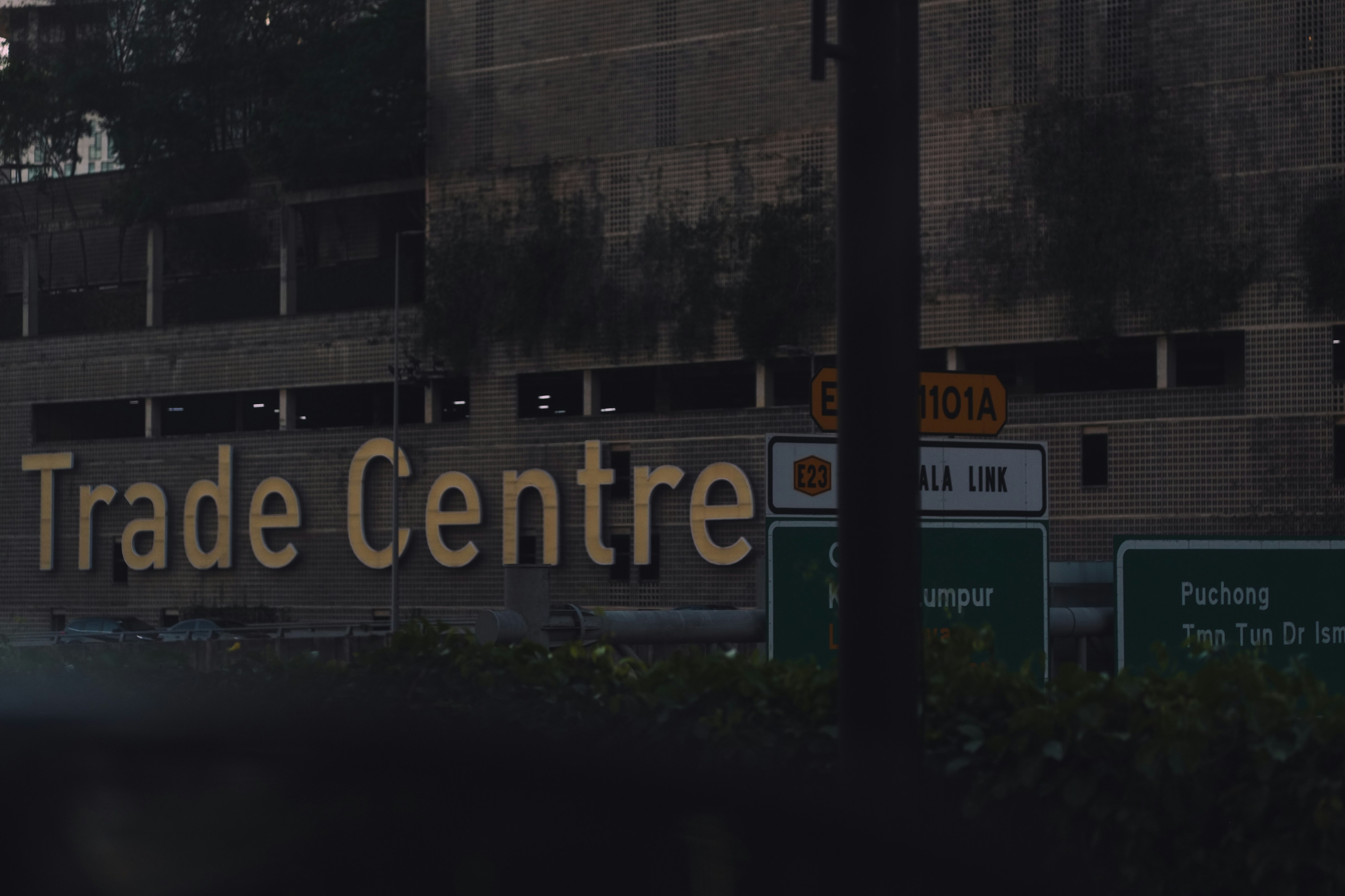 Trade centre sign on a building exterior (Photo by Gilbert Ng on Unsplash)