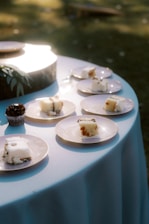 Slices of cake and a cupcake on plates