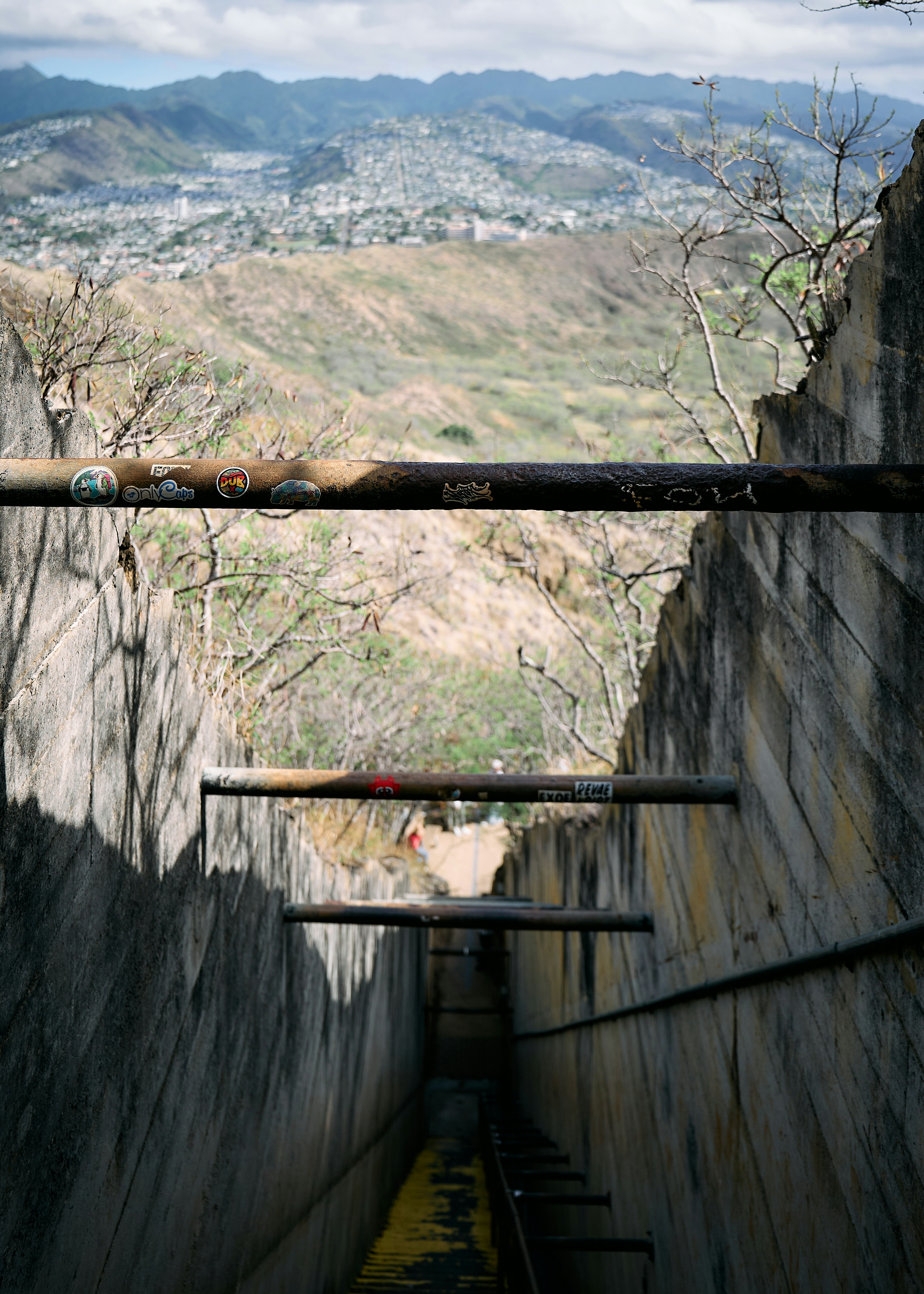 Concrete structure with metal bars overlooking city