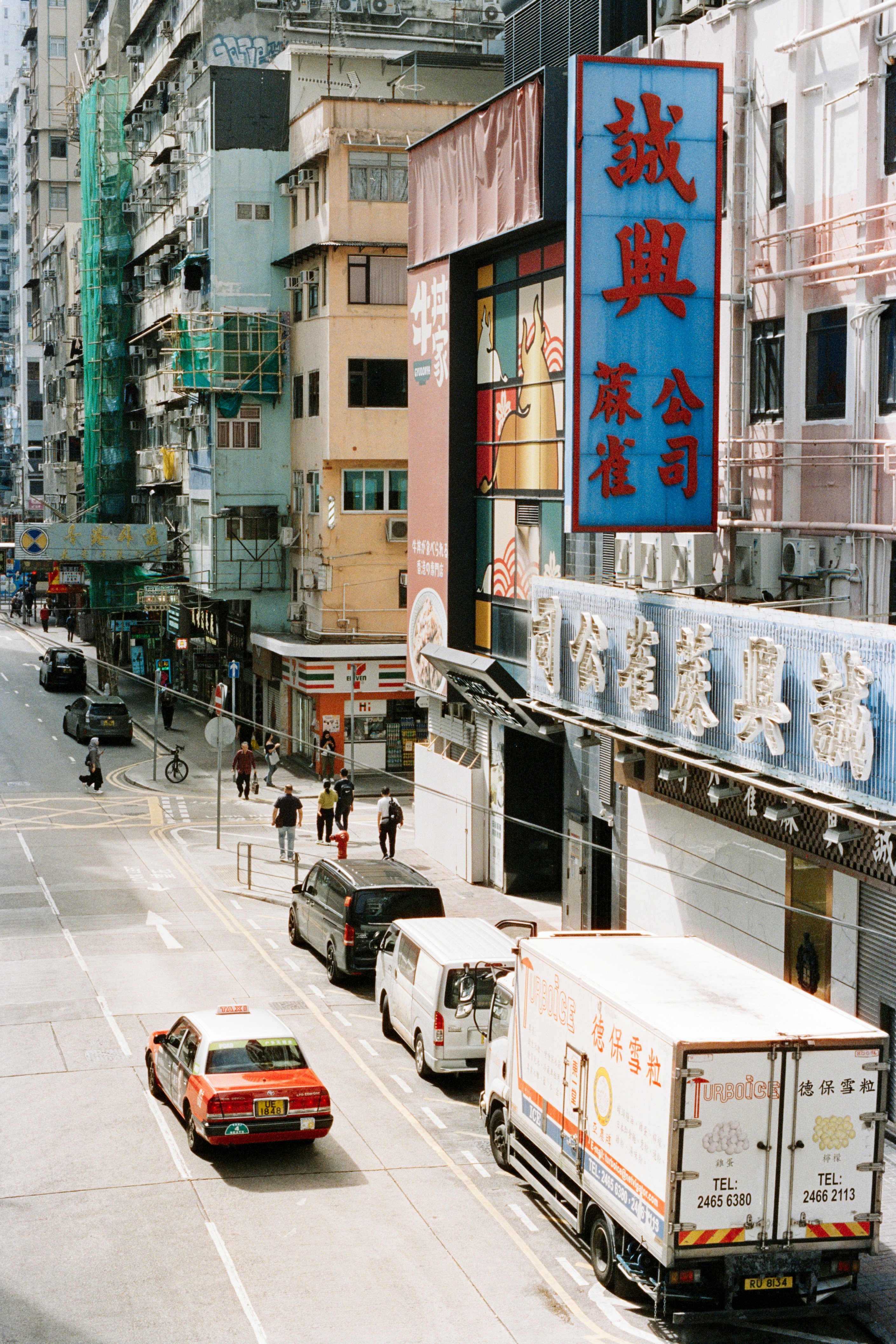 Busy city street with traffic and buildings
