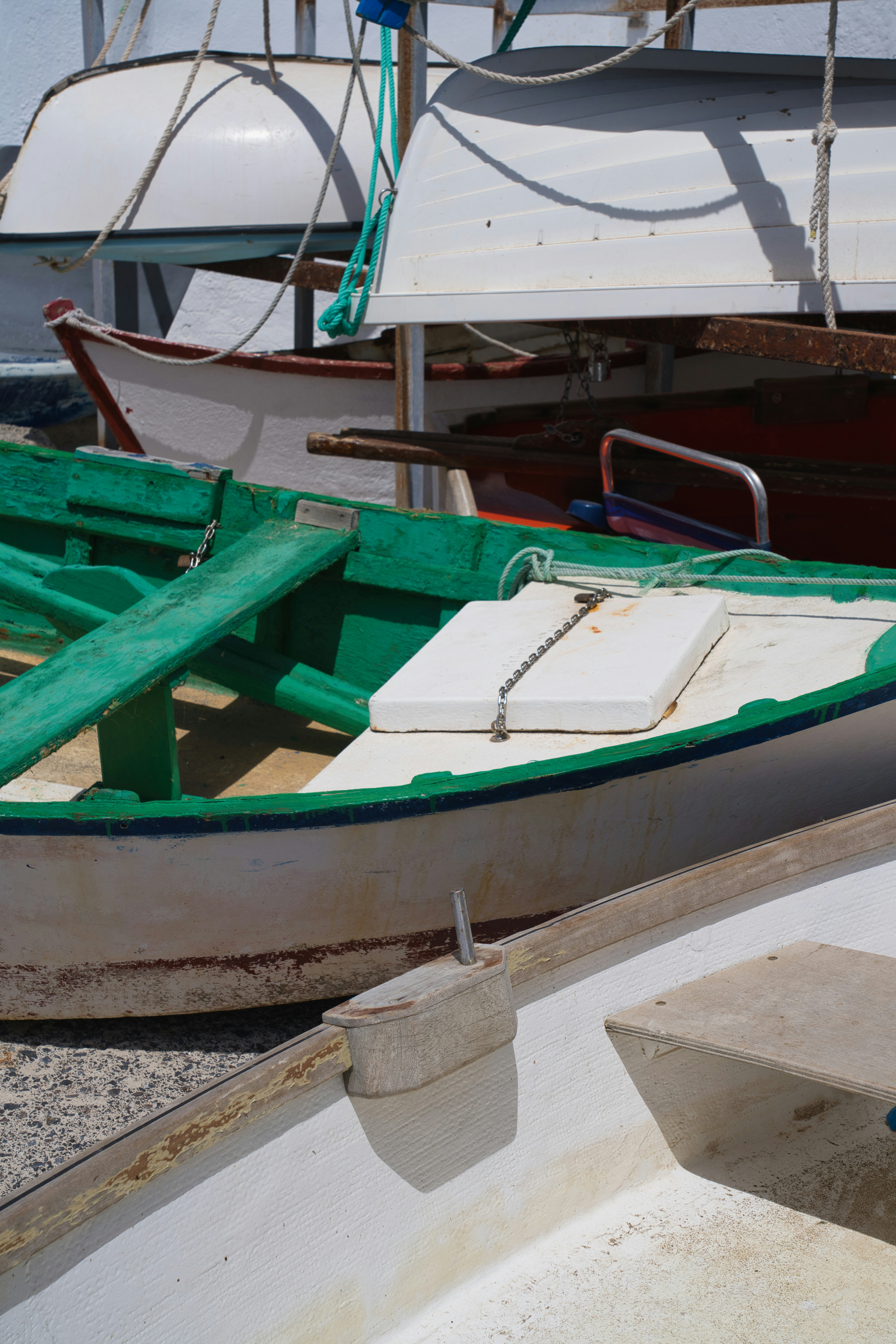 Several small boats docked together in a harbor
