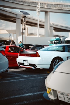 Several sports cars parked in a lot