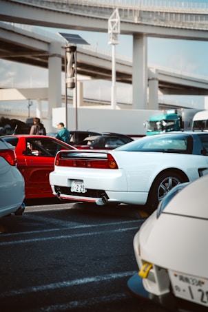 Several sports cars parked in a lot