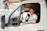 Man driving a white van gives a thumbs up