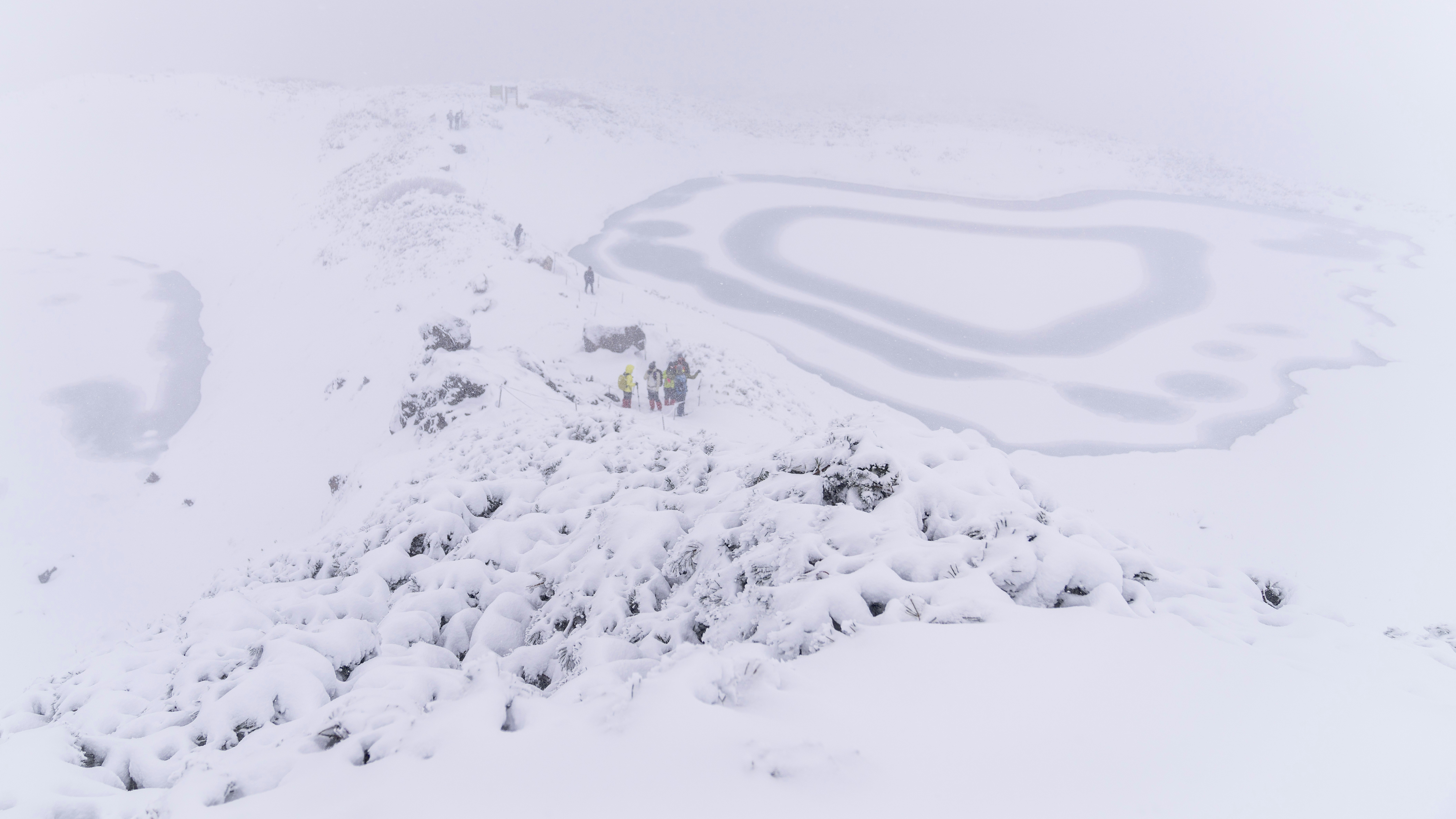 Snow-covered rocks and ice patterns on a winter landscape
