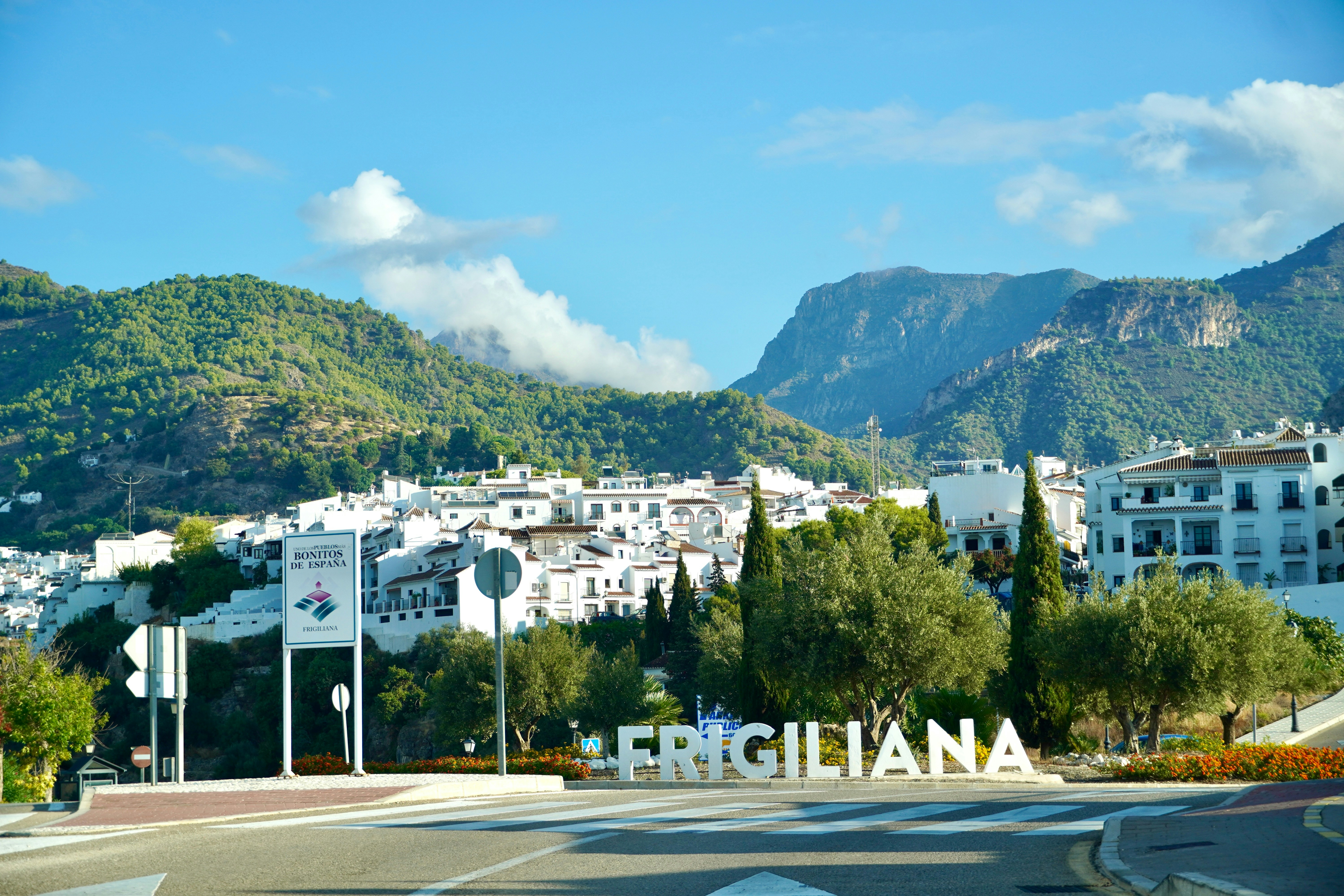 White village of frigiliana nestled in green mountains