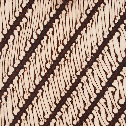 Diagonal pattern of brown lines on cream batik fabric