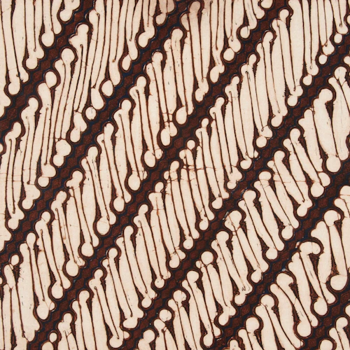 Diagonal pattern of brown lines on cream batik fabric