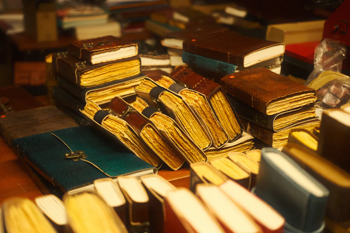 Stacks of old leather-bound books — the out-of-fashion backlist the show works from