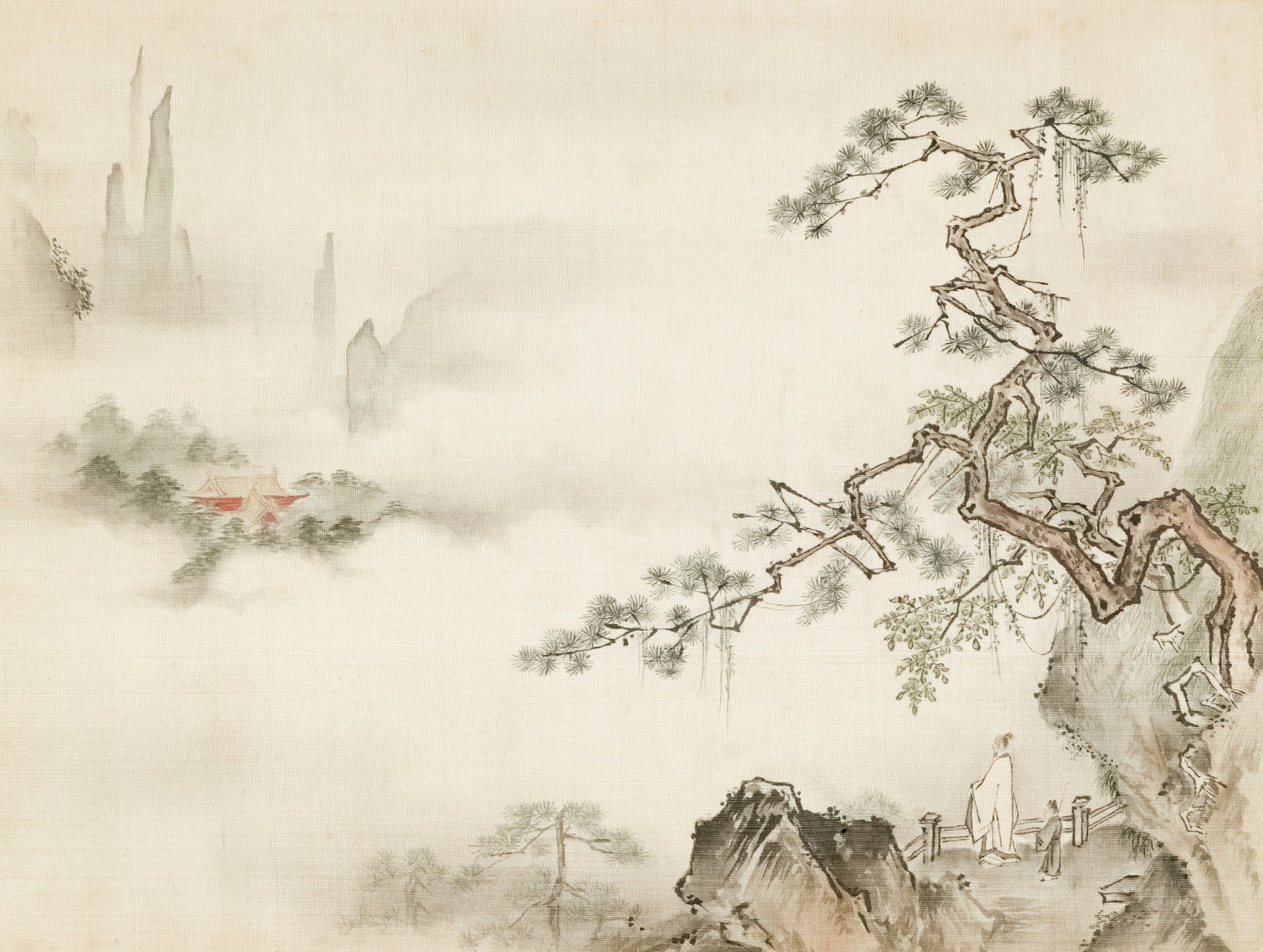 Traditional chinese ink painting of misty mountains and pine.