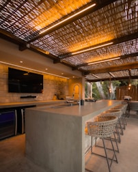 Modern outdoor kitchen with bar and seating
