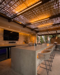 Modern outdoor kitchen with bar and seating
