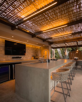 Modern outdoor kitchen with bar and seating