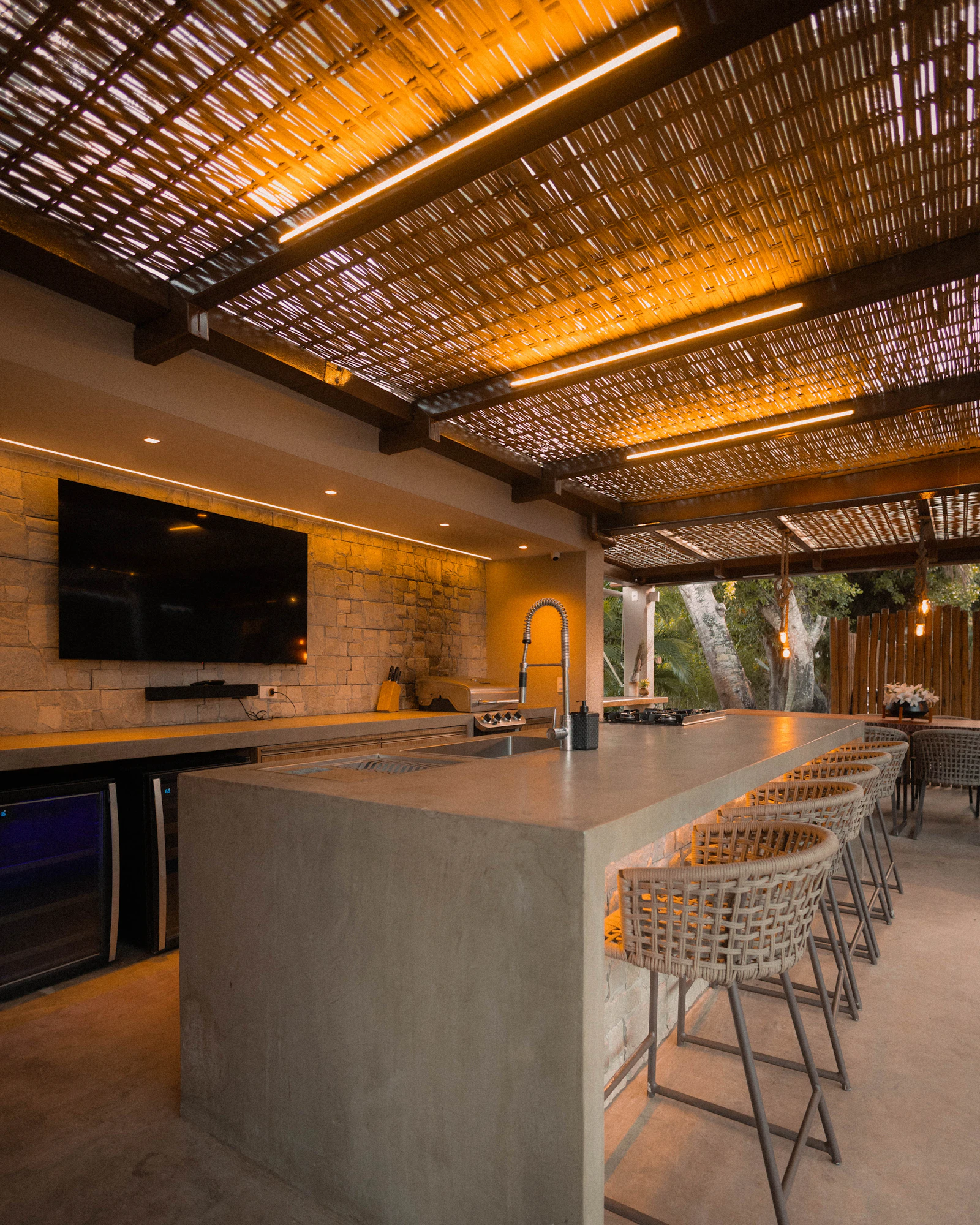 Outdoor kitchen setup with weather-resistant materials and built-in grill