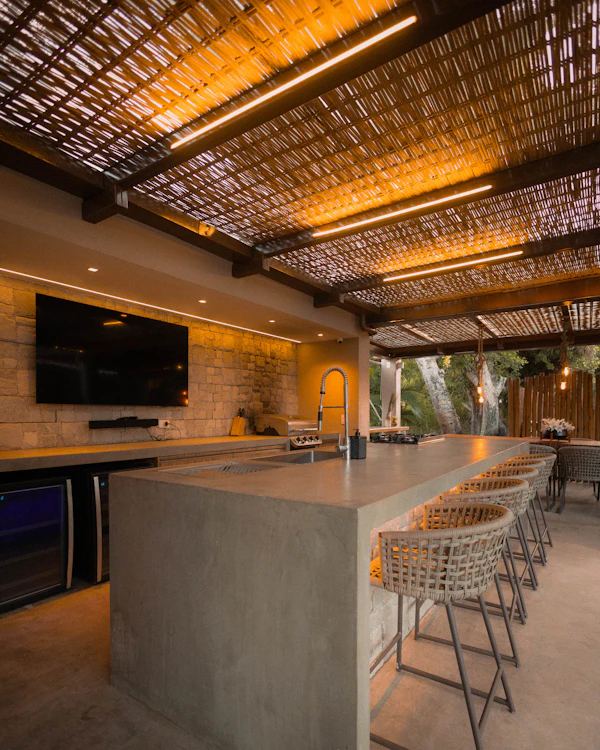 Outdoor Kitchen Planning: Modern outdoor kitchen with bar and seating