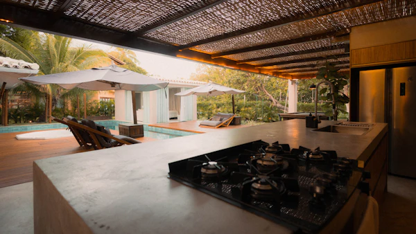 Outdoor Kitchen Planning: Modern outdoor kitchen and pool area