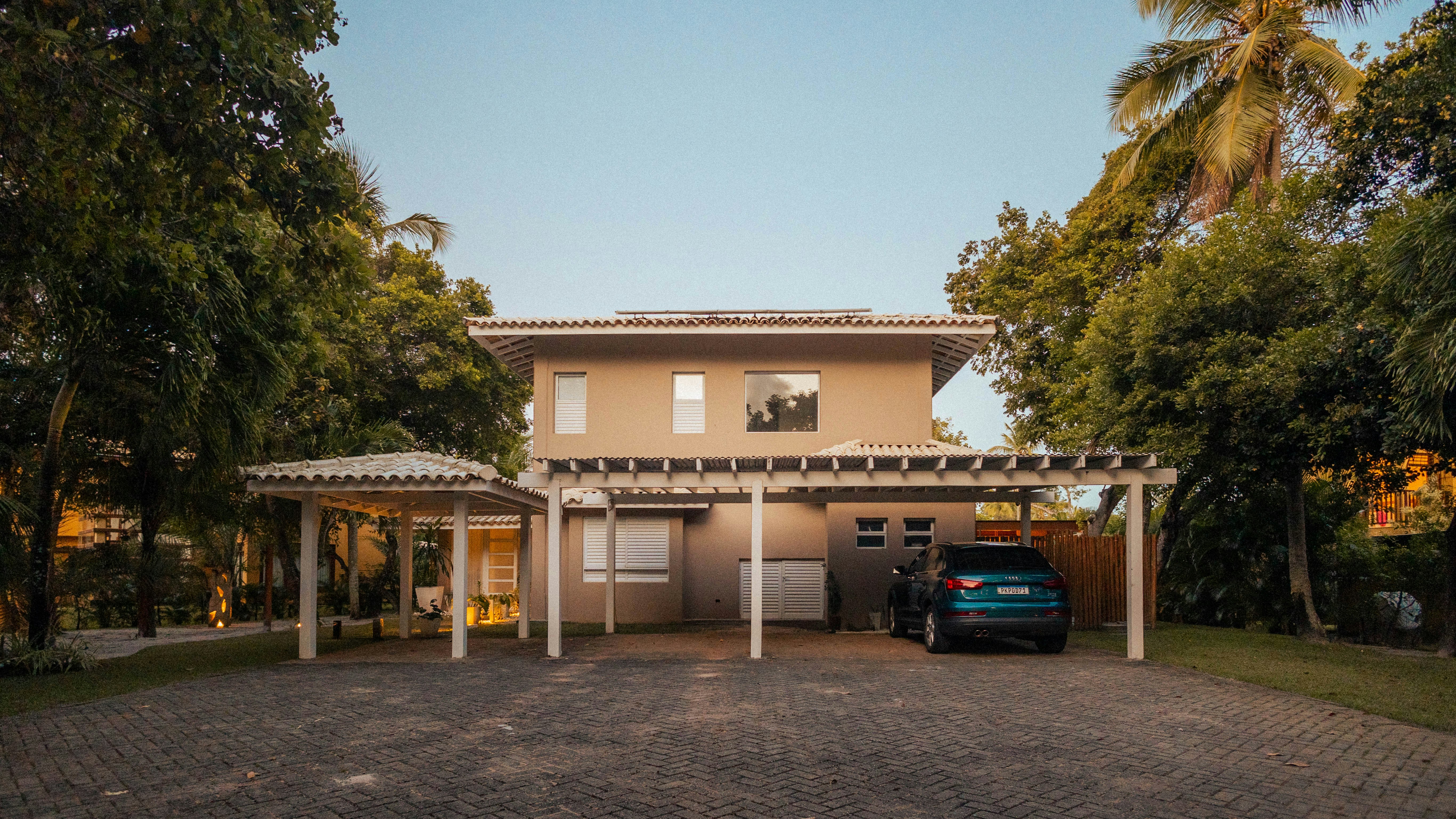 Modern house with carport and car parked outside.