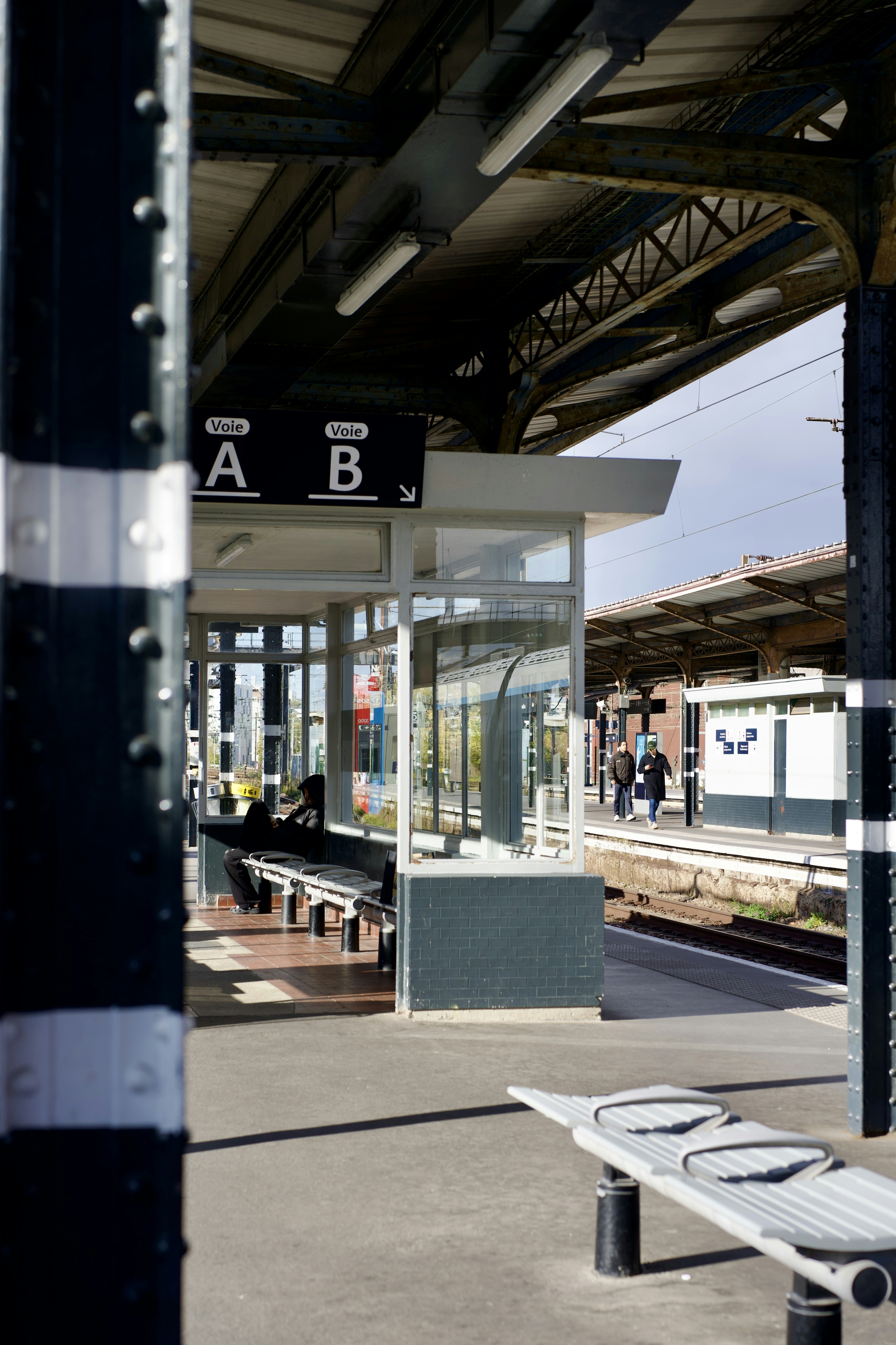 People waiting on a train station platform