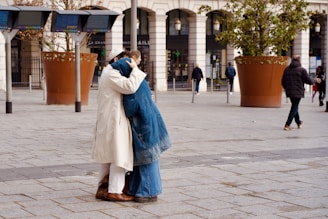Couple embracing in a public square